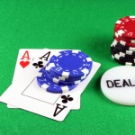 poker - a pair of aces with poker chips 5